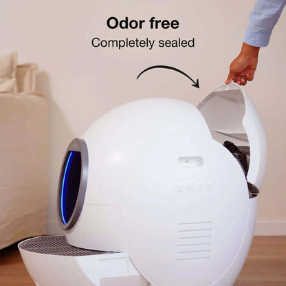 Person demonstrating the odor-free feature of the Smart Self-Cleaning Litter Box with sealed exterior